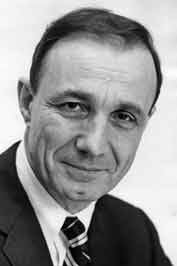 A black and white headshot of a young Dr. Pellegrino who wears a suit and tie.