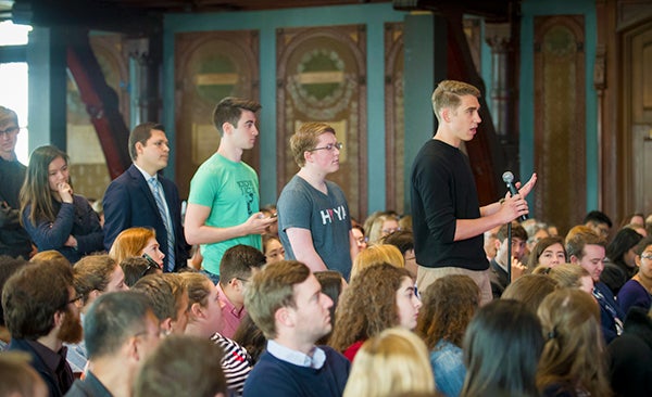 Six students line up to ask Nancy Pelosi questions in the aisle of Gaston Hall.