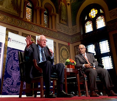 Senator Bernie Sanders sits onstage in Gaston Hall for a discussion with Mo Elleithee.