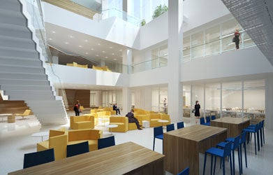 A rendering of the inside of Georgetown Downtown shows work spaces and seating for students, lots of light and open space with a grand staircase leading up two flights