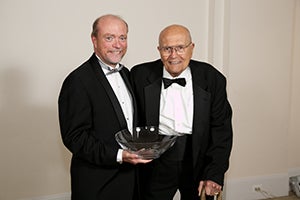 Georgetown Law Dean William Treanor presenting award to John Dingell