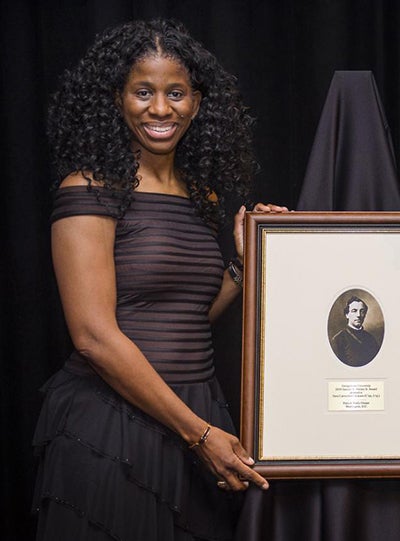 Terri Carmichael Jackson poses with her Samuel A. Halsey Jr. award