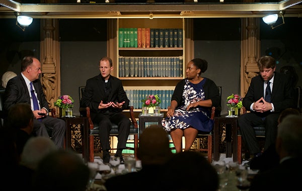 President DeGioia converses with sitting panel that includes professors Matthew Carnes, S.J., Marcia Chatelain and Adam Rothman