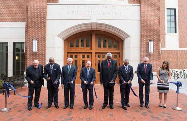 John Thompson, Jr. and President DeGioia and others cut ribbon in front of new athletic building