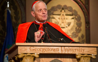 Cardinal Donald Wuerl speaks at a podium to an audience.