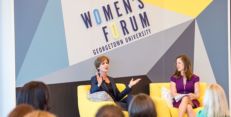 Sally Yates sits talking to the audience as Miram Vogel looks on at the 2018 Women's Forum.