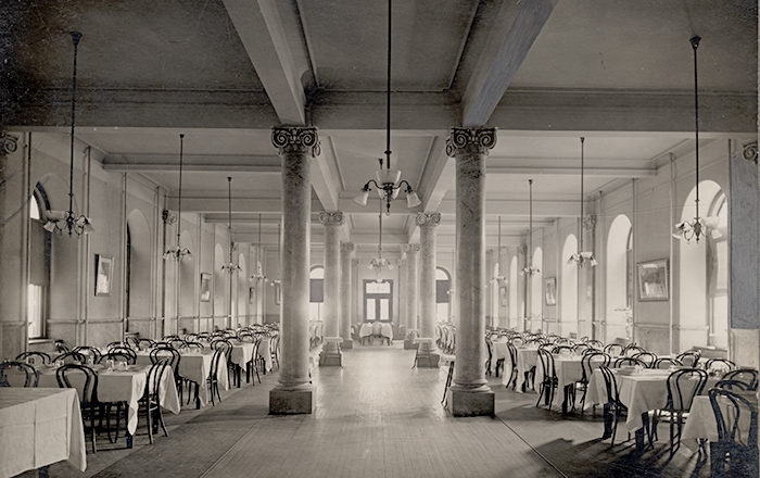 Black and white image from the early 1800s of the original dining hall in Ryan and Mulledy halls.