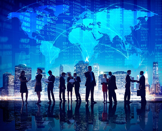 Picture of business people in front of city skyline with stock market symbols hovering above.