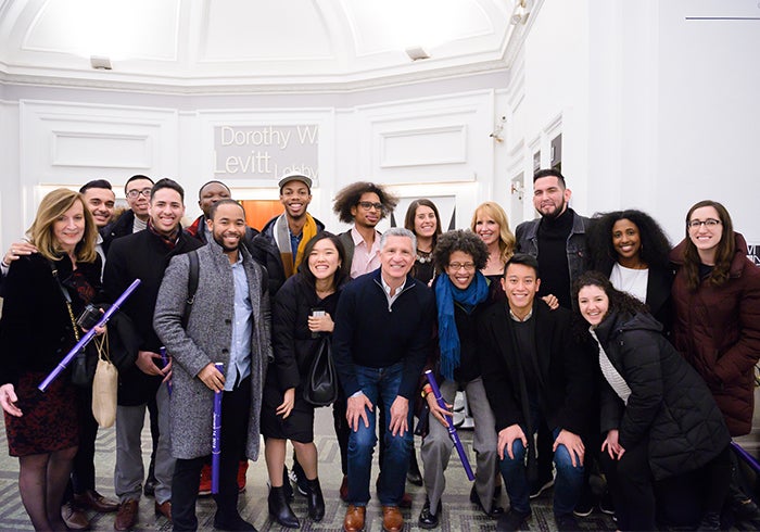 A group of alumni and board members of the Georgetown Scholars Program pose for a photo together.