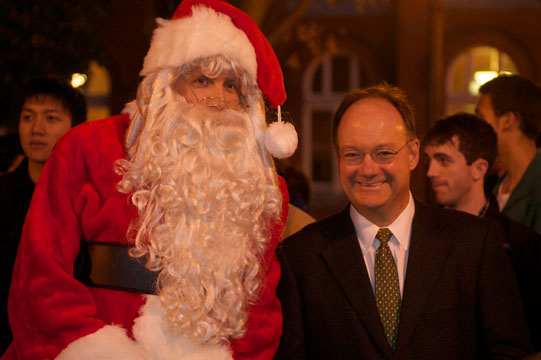 Santa, pictured here with President John J. DeGioia, greets attendees.