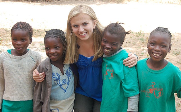 Kendall Ciesemier smiles with four young children at her side. 