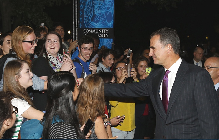 King Felipe VI greets a crowd of students at Georgetown University.