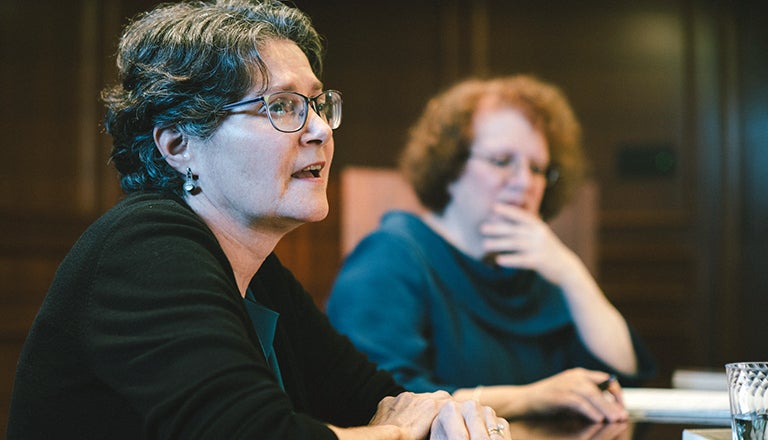 Sherry Linkon seated with Washington Post reporter Amy Goldstein in background