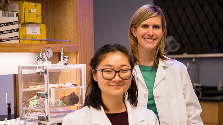 Professor Sarah Stewart Johnson and Angela Bai (C'17) stand together in the lab