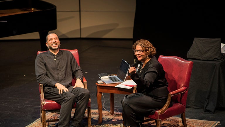 Jason Moran and Elizabeth Alexander have a conversation while sitting on stage.