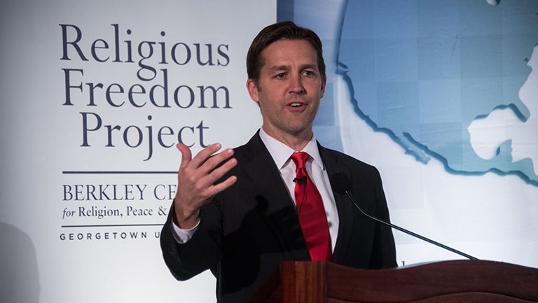 Ben Sasse speaking at podium in front of a sign reading "Religious Freedom Project"