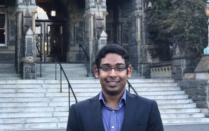 Aditya Pande standing in front of the Healy building