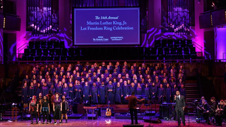 The Rev. Nolan Williams Jr conducts the Let Freedom Ring Choir while georgetown students perform and Phillip Carter sings