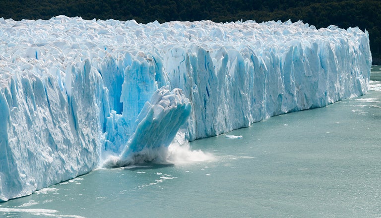 A part of an iceberg collapsing due to climate change