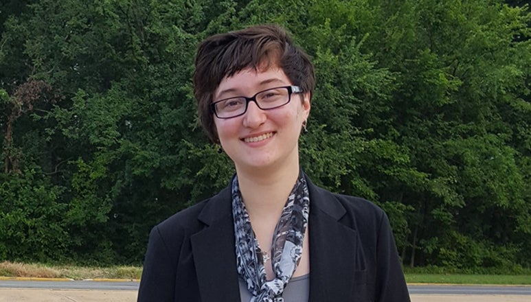 Grace Maglieri standing with trees behind her