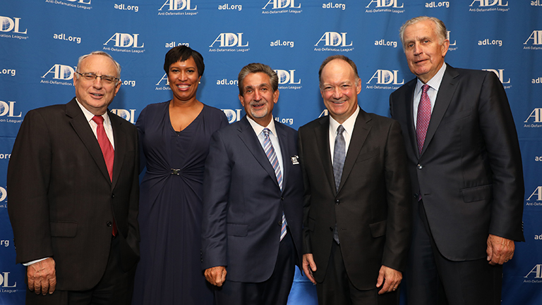 Rabbi David Saperstein, Muriel Bowser, Ted Leonsis, John J.DeGioia and Paul Tagliabue stand in front of an ADL banner