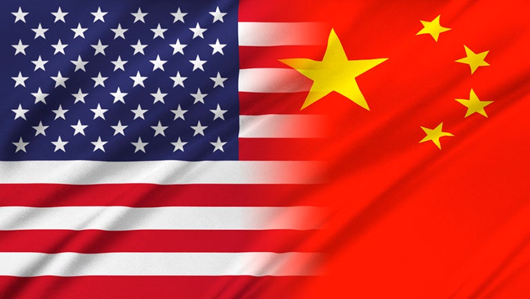 The United States flag blends into the Chinese flag