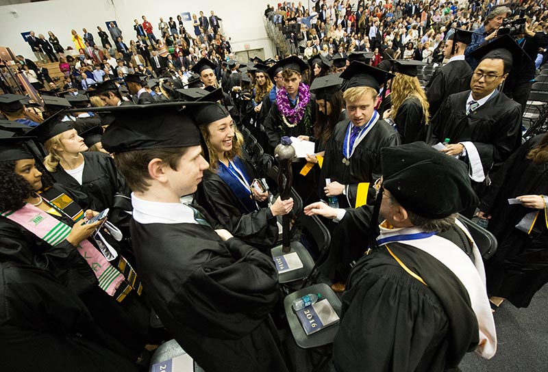 College grads observe the mace