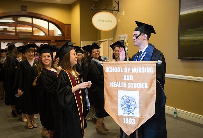 NHS graduates line up before the commencement processional begins