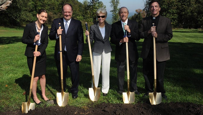 From left to right: Katherine Lewandowski (NHS’12), President John J. DeGioia, Nancy Calcagnini, Arthur Calcagnini and Rev. Kevi