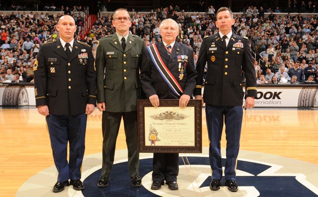 Ray Maxson presents Roy Dyer, Wilder Bullard and Greg Bendewald with plaque at Verizon Center