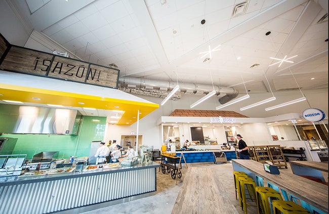 Workers prepare food at two new food stations featuring Mexican and Italian meals in Leo O'Donovan Hall 