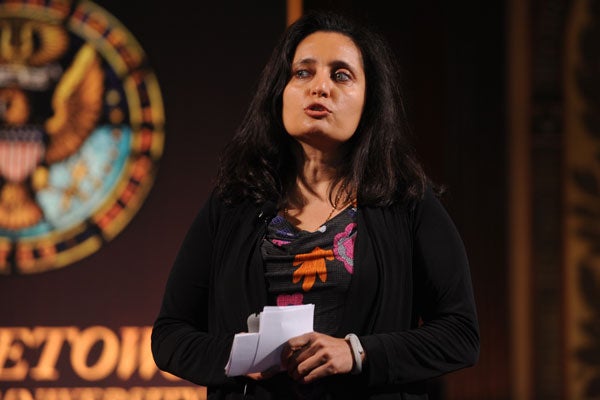 Sonal Shah with seal behind her