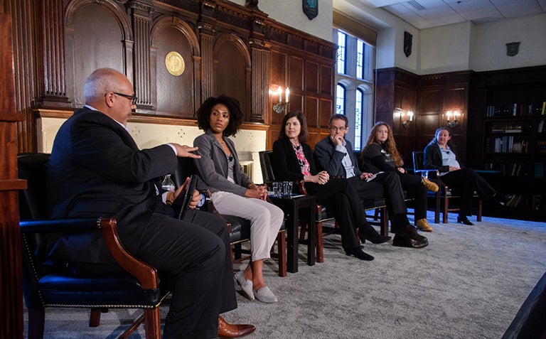 Colleen Roberts, Leslie Crutchfield, David Cole, Sarah Clements and Leticia Bode look at Mo Elleithee as he speaks to them.