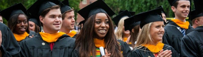 Georgetown University graduates applaud speaker at commencement ceremony.