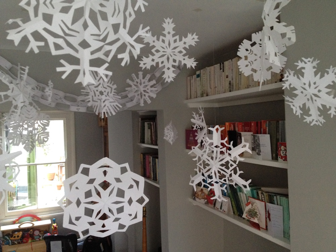 Paper snowflakes hanging from the ceiling.