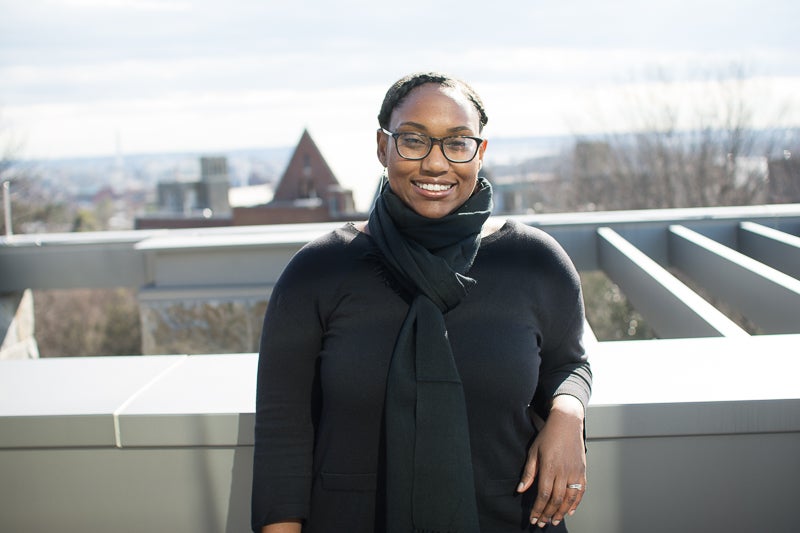 Professor Marcia Chatelain smiles for the camera on a rooftop.