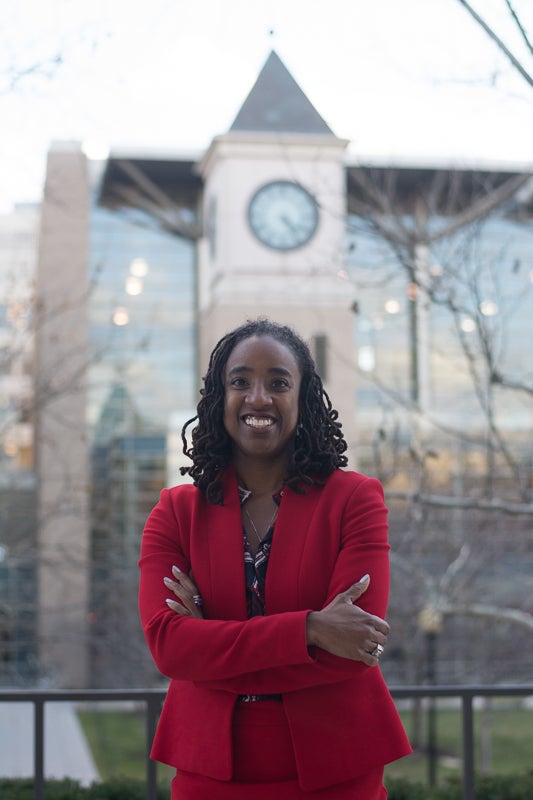 Professor Kris Henning smiles for the camera on the Law Center campus.