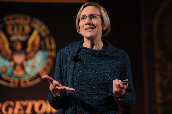 Elizabeth Stanley with Georgetown seal behind her