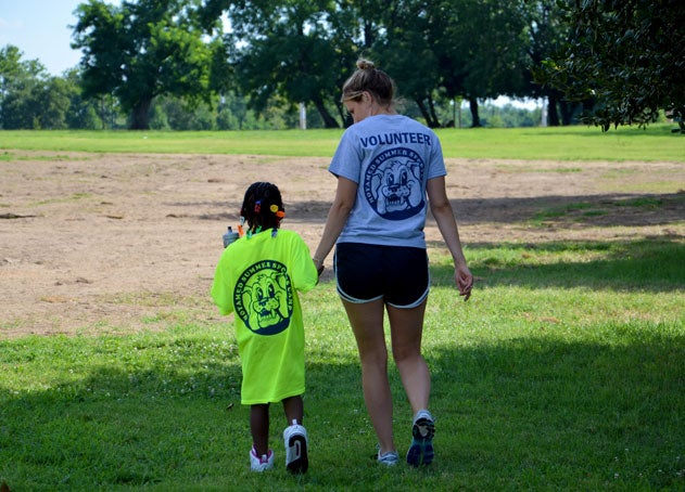 Georgetown medical student walks with young girl in park