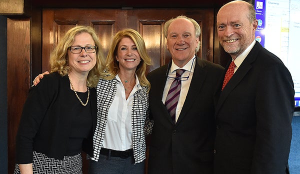 Vicki Arroyo, Wendy Davis, Gerry Hebert and Law Center Dean William Treanor pose for a picture.