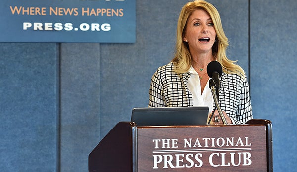 Wendy Davis speaks from a podium.