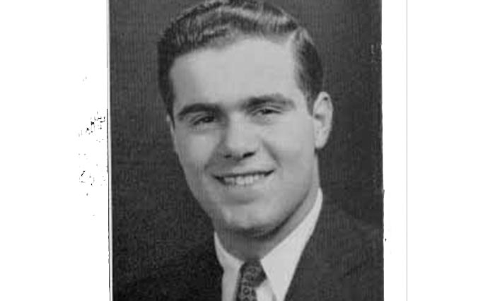 A black and white yearbook photo depicts a young, smiling Atonin Scalia.